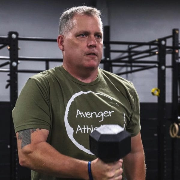 Man lift barbells at Avenger Athletics