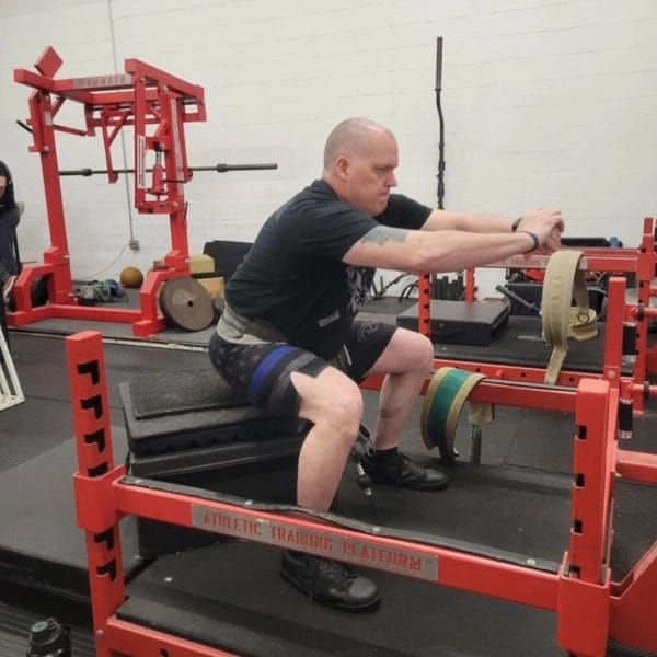 Man stretching at Avenger Athletics